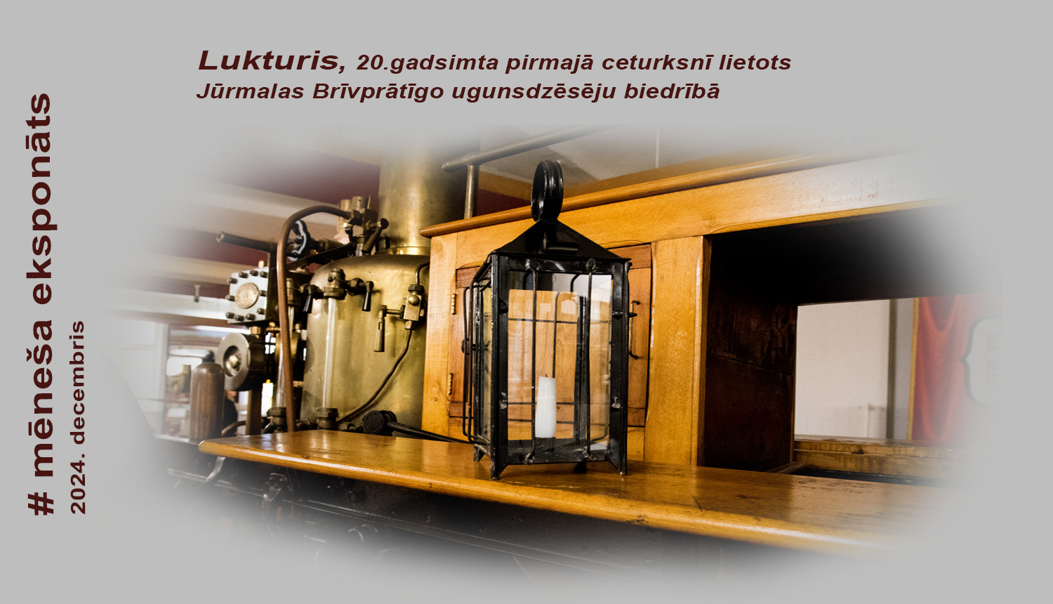 Uz Tvaika sūkņa lafetes novietots taisnstūrveida stikla lukturis melnā ierāmējumā ar rokturīti augšpusē